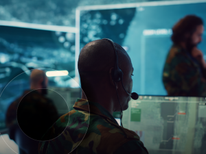 Man with headset looking at screen
